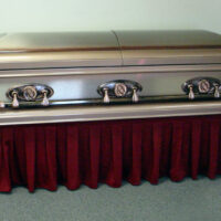 Casket displayed on casket truck with red D400 drape