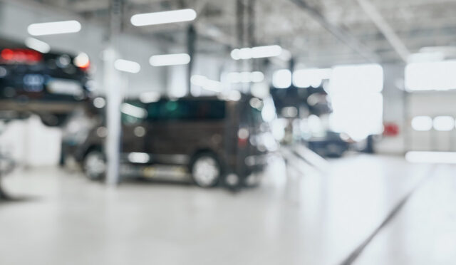 A shop with cars on lifts